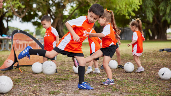 Boy practicing a pull back in Soccer Shots session